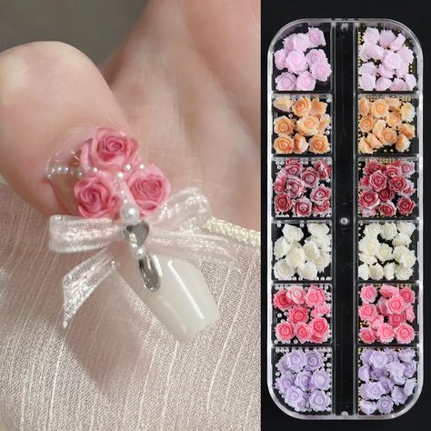 PRICES MAY VARY. 【You Will Get】 12 grids/box 3D acrylic rose flowers nail charms with some full-circle pearls and gold caviar beads. There are 6 colors of the rose charms, including red, pink, white, purple, orange and light pink. Each color comes with two different sizes of flowers, 6mm/8mm, which has slight differences and looks similar. 【3D Acrylic Flowers】The 3D rose charms are made of artificial resin materials, safe and environmentally friendly and harmless. A box contains various colors and different sizes, allows much possibility for nail art design. Each color is packaged in a separate grid for easy storage and carrying. They can be combined with some AB rhinestones, nail powder or nail sequins to create a charming nail art decoration. 【Pearls and Gold Steel beads】The mini metal n Flower Nail Charms, Acrylic Rose, Nail Sequins, 3d Flower Nails, Nail Effects, Manicure Diy, Resin Acrylic, Nail Powder, Camellia Flower