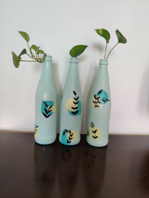 A set of three hand-painted bottles perfect for gifting and home decor Bottle Candle Holder, Painted Glass Bottles, Painted Bottles, Hand Painted Bottles, Buddha Art Painting, Boho Painting, Painted Bottle, Wine Glass Crafts, Glass Bottles Art