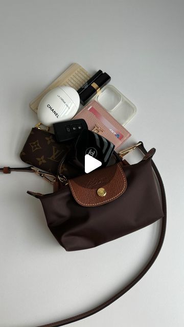 BT Nguyen on Instagram: "She maybe called as a mini, but look how much it could fit 😱  This pouch is going viral, and now I know why! The Le Pliage tote has always been popular choice and known as the most carefree lightweight bag. When the mini was released, I knew I had to get one, or two 🙈   I love how light it is and how much it could hold. I have the ip15 pro max and it fits perfectly 📱   Add on the conversion kit, and ta-dah! You’ve got yourself a cross body bag 😍  *Conversion kit is from @kdaustralia2022   Do you own one? 😍 or will you be purchasing one in the future? 😜   . . .  #wimb #wimbreel #whatsinmybag #baggram #bagblogger #bagblog #purseforum #whatfits #longchamp #longchamplepliage #longchampmini #bagsofinstagram" Longchamp Le Pliage Pouch, Mini Longchamp Bag, Longchamp Pouch, Longchamp Mini Bag, Longchamp Le Pliage Mini, Longchamp Mini, Longchamp Bag, What In My Bag, Going Viral