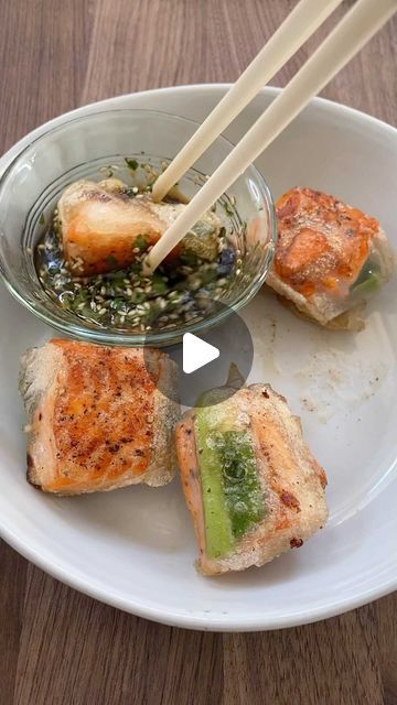 My Nguyen on Instagram: "Save and Share my recipe for Fire Cracker Salmon! It’s so easy to make! Simply fry some salmon, wrap in rice paper and green onions and fry again until crispy. The sauce is 1 tbsp soy sauce, 1 tbsp sesame oil, 1 tsp white vinegar, 1 tsp brown sugar and toss in some sesame seeds and cilantro. #firecrackersalmon #salmonrecipe #salmonroll #ricepaper #asianrecipes #asianfood #appetizerideas #healthyrecipes #easyrecipes #cookingvideos" Salmon Wrapped In Rice Paper, Salmon Rice Wrap, Rice Paper Recipes Salmon, Fire Cracker Salmon, Salmon Spring Rolls, Fried Salmon Recipes, Firecracker Salmon, Rice Paper Recipes, Rice Paper Wraps