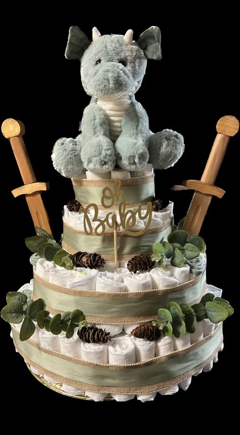 Lotr Gender Reveal, Baby Dragon Shower Ideas, Fantasy Gender Reveal, Dragon Diaper Cake, Mythical Baby Shower Theme, Baby Boy Dragon Nursery, Dragon Baby Shower Cake, Dragon Gender Reveal, Medieval Baby Shower Ideas