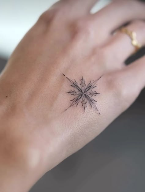 Sun Snowflake Tattoo, Snowflake Hand Tattoo, Fine Line Snowflake Tattoo, Winter Solstice Tattoo, Snow Flakes Tattoo, Christmas Tattoos For Women, Tattoo Under Bum Cheek, Winter Tattoo Ideas, Frost Tattoo