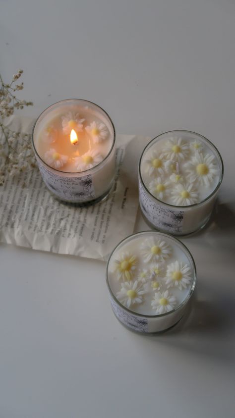 Garden of Eve is a herbal scented candle hand poured in small batches with cruelty free ingredients in our small studio in London.  Relaxing and soothing scents of lavender, chamomile and eucalyptus.  *Each candle presents wax floral details on top for extra cuteness which will melt once the candle is burning.  Ingredients: coconut wax, cruelty free fragrance oil, raw cotton wick.  Scent:  top notes: chamomile               middle notes: lavender and eucalyptus               bottom notes: peppermint and geranium. Mood: self-care moments Wax: 100% natural blend of coconut wax. These candle does not contain any genetically modified ingredients, soy, palm, or paraffin products. Packaging: recyclable round paper box, biodegradable labels, acid free tissue paper, dry flower details and wax seal Candle Making Aesthetic, Christmas Candles Aesthetic, Chamomile Candle, Recycled Candle Jars, Candle Aesthetics, Spring Scented Candles, Candle Pics, Scented Candles Aesthetic, Sented Candles