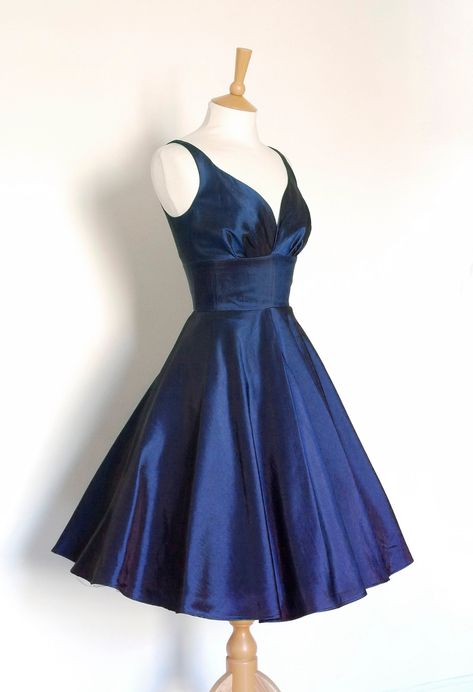 "This stunning evening dress is made from a beautiful Taffeta fabric, seen here in the Midnight Blue colour, perfect for parties, proms or a stunning set of bridesmaids. The Sweetheart neckline and 'Low- V' back make for a classic 1950's evening look and the full skirt can be emphasized with a petticoat (as pictured - petticoat not included) for extra glamour or left to fall naturally. You can choose to have this dress made in any of our coloured Taffeta's shown in the final image. Please select Dark Blue Silk Dress, Midnight Blue Prom Dresses, Prom Dresses Short Blue, Deep Blue Dress, Dig For Victory, Short Dresses Party, Midnight Blue Dress, Homecoming Dress Short, Blue Dress Short