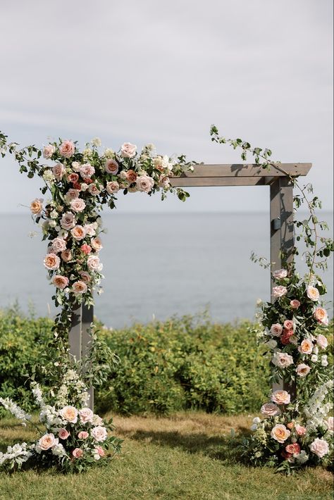 Searching for that luxury garden inspired wedding look? That’s my favorite! Check out this ceremony backdrop in front of the beautiful Nantucket Sound. I’m Courtney! A luxury wedding florist serving Boston, Cape Cod, & Newport, Rhode Island. I have a never ending passion for florals, & I can’t wait to bring your dream vision to life! Ceremony Pergola Flowers, Rectangle Arbor Wedding Flowers, Garden Wedding Arch Outdoor Ceremony, Wedding Ceremony Pergola, Wedding Arbor Florals, Outdoor Chuppah, Arbor Flowers Wedding, Wedding Gazebo Flowers, Wedding Florals Ceremony