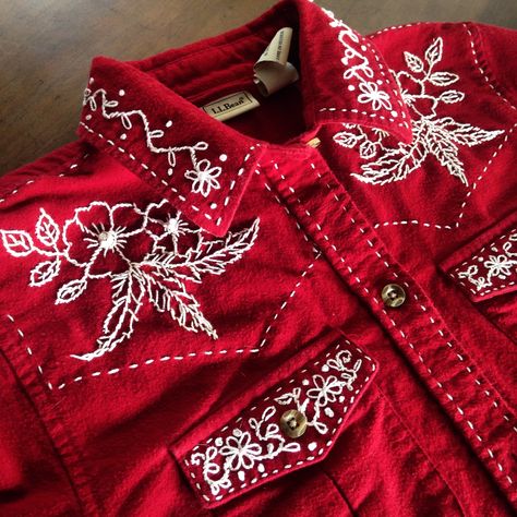 My first attempt at hand embroidery. Flowers and feathers western shirt. Red Western Shirt, Western Shirt Embroidery, Diy Western Shirt, Cowboy Embroidery Designs, Western Embroidery Designs, Embroidered Western Shirt, Cowboy Embroidery, Embroidery Jeans Jacket, Flowers And Feathers