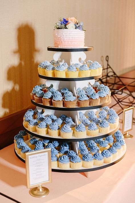 Blue Wedding Cakes Simple, Blue Wedding Cupcake Tower, Light Blue Cupcakes Wedding, Dusty Blue And Peach Wedding Cake, Pastel Blue Wedding Cake, Blue Wedding Cupcakes Ideas, Dusty Blue Wedding Cake With Cupcakes, Powder Blue Wedding Cake, Blue Cupcakes Wedding