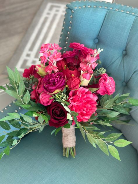 Stunning Wedding bouquet in fuchsia, hot pink, purple, red, and magenta. This bouquet is made with high quality silk flowers consisting of dahlias, roses, hydrangeas, and Italian Ruscus leaves. It has all the elegance, beauty and romance you could want and will complement and wedding dress! Each floral arrangement is handmade with great attention to detail and fine craftsmanship. Bouquets are finished with ribbon color of your choice. You can be sure to love the product you receive and it will l Fall Pink Floral Arrangements, Hot Pink Wedding Flowers Centerpieces, White Roses Flower Bouquet, Pink Red Bridal Bouquet, Hot Pink Hoco Bouquet, Red Pink Wedding Flowers, Hot Pink Beach Wedding, Red Dress Flowers Bouquets, Pink Red And Green Wedding