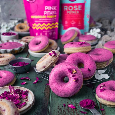 When we said a dozen roses, we truly meant a dozen rose donuts! These moist and crumbly rose donuts with the prettiest pink pitaya glaze will make a perfect bouquet and heavenly delicious. We are using Suncore Foods® Rose Petals Superbloom to add a distinct rose aroma and aesthetically pleasing to look at. No donuts are completed without glaze, use Suncore Foods® Pink Pitaya Supercolor Powder to achieve this sweet, lovely yet elegant pink glaze. Impress your loved ones with this exquisite recipe Dragon Fruit Dragon, Dragon Fruit Powder, Donut Tray, Pink Pitaya, Fruit Dragon, Sweet Potato Powder, Red Dragon Fruit, Fruit Powder, Dozen Roses