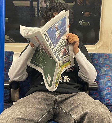 Reading Newspaper Pose, Guy Reading Newspaper, Person Reading Newspaper, Reading Reference Pose, Guy On Train, Reading Newspaper Aesthetic, Newspaper Reference, Man Reading Newspaper, Newspaper Photoshoot