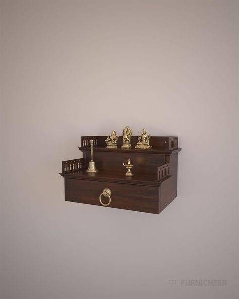 SKU : KAVI-TLWL1912NN Size in cm : L 48 x D 31.5 x H 29.2 Product weight in kg : 7 Package weight in kg : 12.5 Handcrafted solid wood 2 step wall mounted pooja mandir in walnut brown PU finish which enhances your prayer space Features : -Wall mount -2 stepped unit -Drawer  to house pooja essentials  -Lattice trims on side edges Material : -Phyto certified American solid tulip wood -Kiln-dried sustainable hardwood -Walnut stained premium PU finish by ica Italy Accessories : - 1 Brass knob Hardwar Wood Artifacts, Pooja Shelf, Mandir For Home, Puja Mandir, Italy Accessories, Vintage Brass Decor, Side Edges, Temple Design For Home, Wood Kiln