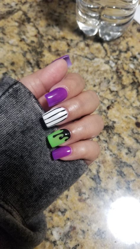 Purple And Orange Halloween Nails Acrylic, Beetlejuice Nails Acrylic Coffin, Purple Green And Orange Nails, Beetle Juice Nails Designs, Green And Purple Nails Halloween, Beetlejuice Nails Square, Orange Black Purple Green Halloween Nails, Purple Green Halloween Nails, Beetlejuice Inspired Nails