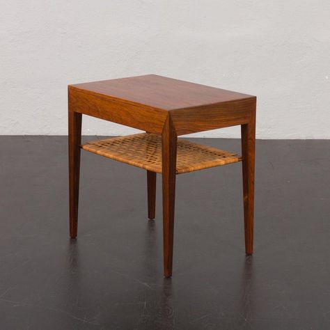 Simple yet elegant vintage side table designed by Severin Hansen for Haslev Mobelfrabrik in the 1960s. Original label preserved. It can also be a stunning addition to the bedroom. It shows mastery of Danish mid-century craftsmanship exemplified in beautifully grained rosewood veneer and masterly wood joints. It is confirmed by Danish Control label underneath the table. This vintage side table features a perfectly integrated hidden drawer and an original cane wickerwork shelf, useful for magazine Cane Side Table, Hidden Drawer, Rattan Side Table, Brass Side Table, Wood Joints, Vintage Bauhaus, Vintage Side Table, Side Table Design, Living Room Side Table