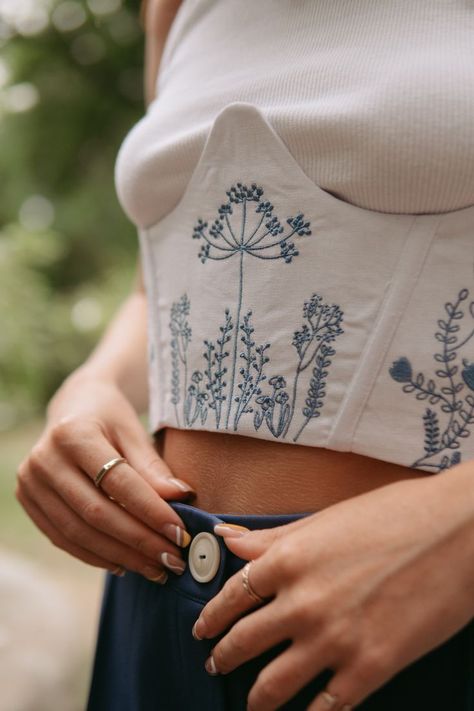 Place your order on our Etsy shop. Floral Aesthetic Underbust Linen Corset Embroidered Black White Bustier Eyelet and Grommet Closure Top. You can choose embroidery color from thread palette. #aestheticcorset #floralcorset #embroideredcorset #underbustcorset #aestheticbustier #linencorset #aestheticlothes #floralembroidery #whitecorset #blackcorset #beigecorset #bustier #linenclothes #handmadecorset #bohocorset #corsettop Embroidered Bustier Top, Embroidery Corset Top, Embroidered Corset Belt, Linen Corset Top, White Dress Embroidery, Embroided Top, Corset Embroidery, Blazer Embroidery, Embroidered Corset Top