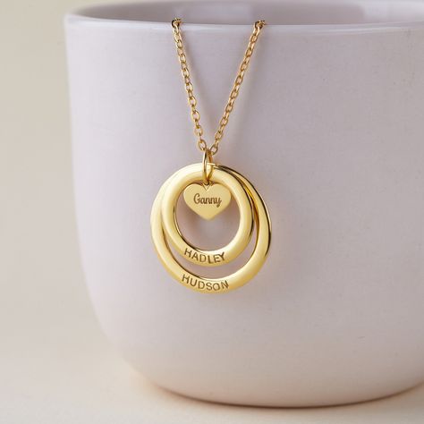 "This necklace is a meaningful and sweet gift for a mom/grandma, with her being in centre on a heart charm and kids/grandkids' names surrounding her. A perfect gift for Mom/Grandma on any occasion. PRODUCT INFO * Materials: 925 sterling silver with 18K yellow gold or rose gold plate options.  * Small ring measures approx. 3/4\" (20mm). Big ring measures approx. 1\" (26mm). Heart charm approx. 0.37\" x 0.32\" (9.8 x 8.5mm) * WORD LIMIT: Small ring: 4-5 words / Big ring: 6 words. Date is counted a Nana Jewelry, Grammy Gift, Necklace With Kids Names, Names Necklace, Grandmother Necklace, Necklace With Name, Grandmother Jewelry, Name Necklace Silver, Black Beads Mangalsutra Design