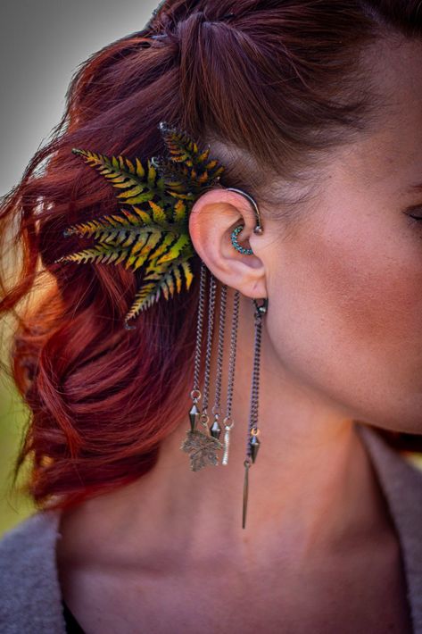 Introducing our handmade leather fern ear cuff wrap with a stunning 3D realistic design. Each cuff is meticulously hand-tooled and painted with leather ferns, which are individually hand-dyed using special techniques, waxed, and shaped by hand to create a nature-inspired statement piece that is perfect for adding a touch of boho style to any outfit. This ear cuff is perfect for everyday wear, fairs, festivals, renaissance faires, and costumes, making it a must-have accessory for anyone who loves Cottagecore Style, Aging Beautifully, Fantasy Clothing, Leather Keychain, Festival Wear, Belly Dance, Handmade Leather, Nature Inspired, Fern