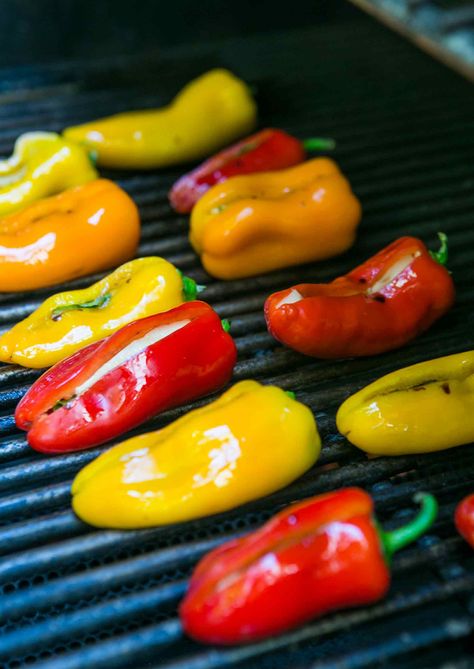 Perfect summer appetizer! These sweet mini peppers are stuffed with smoked mozzarella cheese and basil. Grill, bake, or broil. So easy! A real crowd pleaser. Great as a side for chicken or pork too. Side For Chicken, Mini Peppers Stuffed, Mini Peppers Recipes, Bbq Competition, Grill Dessert, Smoked Mozzarella, Mini Peppers, Stuffed Mini Peppers, Summer Appetizer