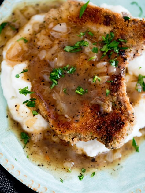 Crispy fried pork chops with gravy are tender and juicy on the inside with a crispy, flavorful outside. They are perfect over mashed potatoes. Pork Chops Mashed Potatoes Gravy, Pork Chop And Mashed Potatoes Recipes, Pork Chops With Gravy Skillet, Fried Pork Chops With Gravy, Pork Chops And Mashed Potatoes, Fried Pork Chops And Gravy, Pork Chops With Gravy, Pork Sirloin Chops, Skillet Pork Chop Recipes