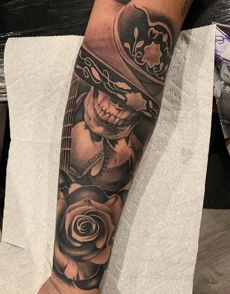 135+ Mexican Tattoo Ideas For An Authentic Tattoo Design Dc Sleeve Tattoo, Day Of The Dead Tattoo Men, Mexican Flag Tattoos For Women, Chicano Arm Tattoo, Mexican Sleeve Tattoo, Mexican American Tattoos, Mexican Tattoo Ideas For Men, Mexico Tattoo Ideas, Mexican Traditional Tattoo