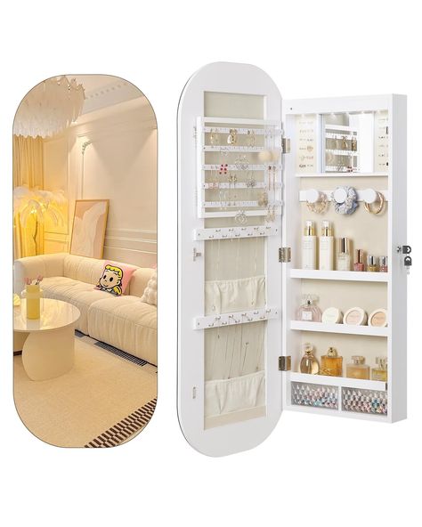 PRICES MAY VARY. [WIDE FRAMELESS MIRROR]: With 3.9"D x 16.5"W x 42.5"H hanging jewelry organizer, you will enjoy a broad 16.5” view than standard jewelry mirrors. Get everything prepared easily and simplify your morning routine. [3-In-1 SPACE SAVER]: This round-shaped mirror serves as a perfect full-length mirror for your daily routine, while offering comprehensive protection for your jewelry & cosmetics. The stylish design makes it a great addition to your room. [BUILT-IN LIGHTED MIRROR ]: Feat Mirror Storage Bedroom, Hanging Mirror Storage, Full Mirror With Storage, Built In Jewelry Storage, Aesthetic Jewelry Organizer, Aesthetic Jewelry Organization, Mirror For Small Bedroom, Themed Bedroom Decor, Mirror Room Ideas