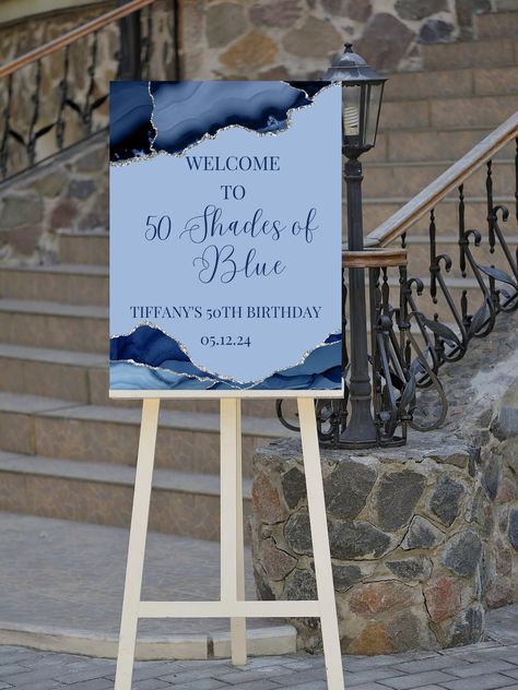 Add to your birthday decor with this editable shades of blue birthday welcome sign, perfect for your next birthday party or birthday dinner. This blue agate welcome poster can be edited yourself using Canva. Print at home or take completed file to your local print shop and have them print. Print size is 18x24. All the wording is editable. Details: blue agate birthday party welcome sign, shades of blue. Great to use for a shades of blue theme. Wording can be changed to accommodate all the great m Blue And White 40th Birthday Party, Navy Blue And Silver Table Decorations, Fifty Shades Of Blue Party Ideas, Shades Of Blue Theme Party, 50 Shades Of Blue Party Ideas, Blue Brunch Decor, 50 Shades Of Blue Birthday Party, Shades Of Blue Birthday Party Ideas, Black And Blue Birthday Decorations