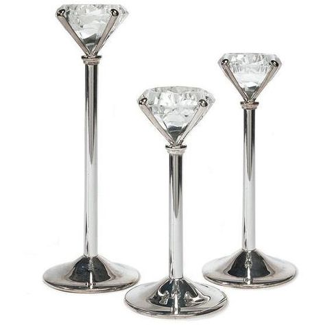 Add elegance and glam to any table setting during or after the big day. The silver plated diamond ring shaped tea light holders come in a set of three assorted sizes per package. Perfect for your "Bling" themed wedding or party Size: 7 1/4", 8 1/4", 10" Product dimensions: Silver Centerpieces, Diamond Ring Shape, Tea Lights Wedding, Tea Light Holder Wedding, Diamond Candles, Diamond Party, Denim And Diamonds, Silver Candle, Diamond Bling