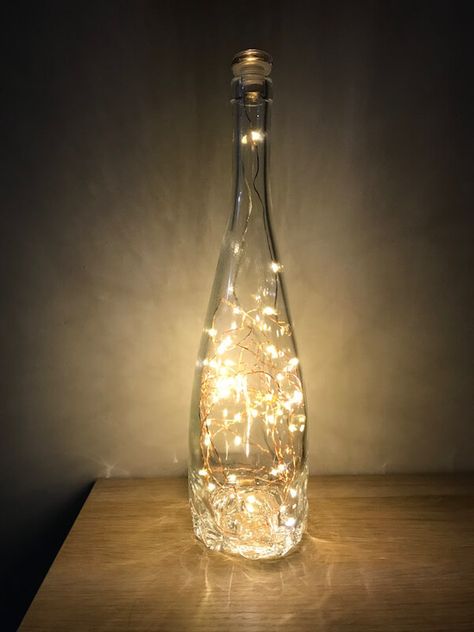 Lights Made From Wine Bottles, Fairy Light Wine Bottles, Wine Bottle Lights Diy, Lights In A Bottle, Pretty Wine Bottles, Wine Decorations, Champaign Bottle, Wine Bottle With Lights, Giant Wine Glass