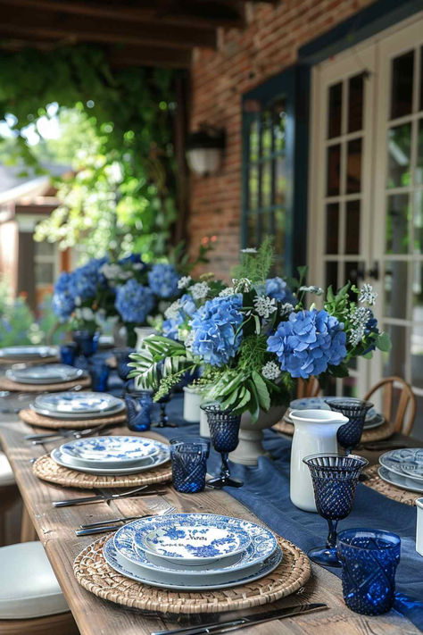 40 Elegant Outdoor Table Decor Ideas for a Classy Affair End Of Summer Tablescapes, Summer Plates Table Settings, White Blue Table Setting, Beach Table Setting Ideas, Patio Dining Table Decor Ideas, Blue Hydrangea Tablescape, Blue White Table Decor, Setting The Table For Dinner, Informal Table Setting Ideas