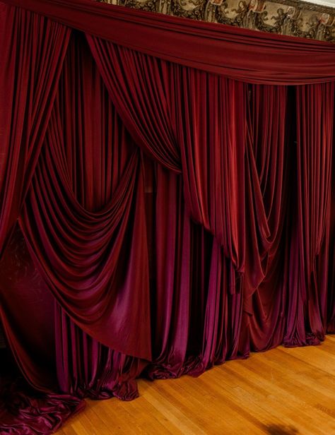 Burgundy draping inspiration • Art Nouveau Inspired Moody Wedding Editorial at Colvin House • Savoir Fête, Chicago Wedding Planner • Photography by Alex Ferreri Velvet Fabric Backdrop, Wedding Drapery Ideas Receptions, Fabric Draped Walls, Moody Red Wedding, Red Party Themes, Planner Photography, Burgundy Decor, Red Velvet Curtains, Burgundy Aesthetic