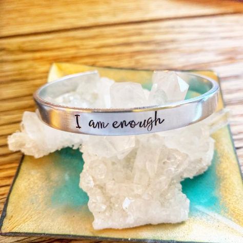 This cuff bracelet is hand stamped with “I am Enough”. • Handcrafted from your choice of .925 sterling silver, 14k rose gold filled, 20k rose gold filled, alumimum, copper, or Nugold (brass) • Measures 1/4th of an inch by 6 inches • Each piece is unique having been shaped and Handstamped by the Winchester Va, Healing Vibes, Recovery Gifts, I Am Enough, Kraft Gift Boxes, You Are Enough, Stone Design, Etsy Handmade, Metal Stamping