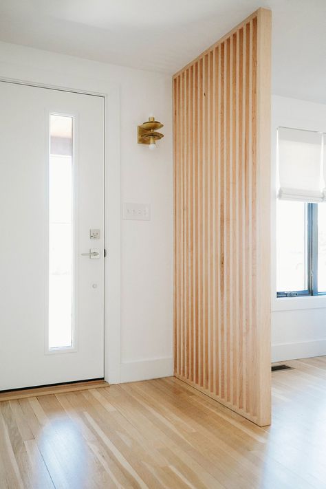 Slat Wall Separation, Wall Divider Entryway, Slat Wall Divider Entry, Separation Door Design, Light Wood Mid Century Modern, Slat Wall Front Entrance, Wood Slat Divider Wall Entryway, Vertical Slat Room Divider, Entry Divider Ideas