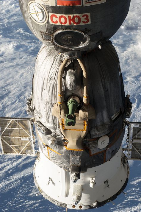 A Russian Soyuz spacecraft is seen docked to the International Space Station, as photographed by one of the Expedition 39 crew members aboard the orbital outpost. [Read the Full Story Here] [Read the Full Story Here] Soviet Space Program, Soyuz Spacecraft, Robot Mechanics, Nasa Photos, Space Stuff, Space Race, Spaceship Design, Air Space, Astronauts In Space