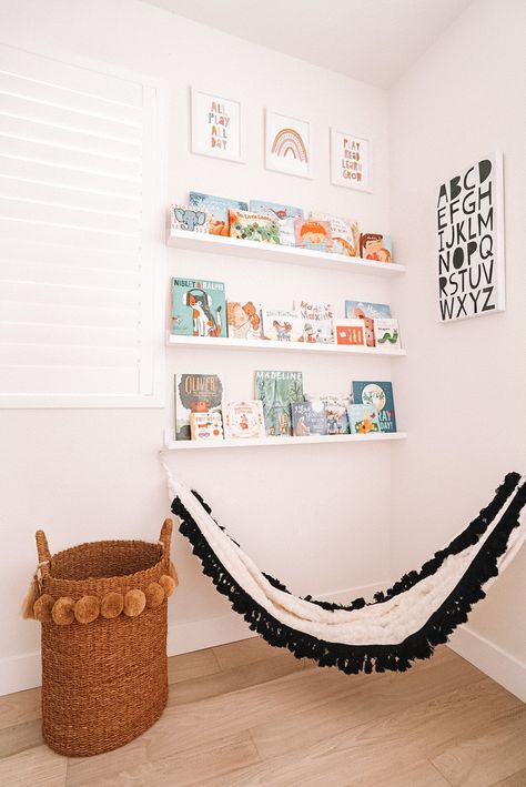 One of the kid's favorite spots in the house is this reading corner in their playroom! I made this book wall to display all their favorite books and added a cute kid hammock! It is a functional yet pretty spot to store all their favorite books! #sponsored #buybuybaby #babyhood #bookwall #readingcorner #playroomideas #playroomdecor Playroom Reading Corner Cozy, Toy Room Reading Corner, Playroom Hammock, Hammock In Bedroom Kids, Kids Room Hammock, Kids Hammock Bedroom, Reading Corner Girls Bedroom, Boys Reading Corner, Reading Corner Playroom