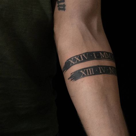 Greek Date Tattoo, Band Tattoos For Men Bicep, Roman Birth Date Tattoo, Unique Band Tattoos For Men, Cross With Roman Numerals Tattoo, Dates Tattoo Ideas For Men, Date Birth Tattoo, Men Family Tattoo, Family Date Tattoo