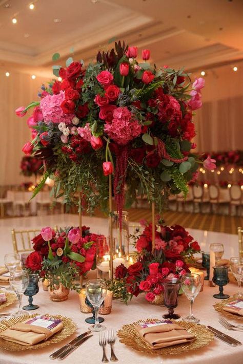 Romantic, floral centerpiece - tall, red and pink centerpieces with roses, tulips and greenery - Find your florist on WeddingWire! {Vanessa Jaimes Floral Design} Shades Of Pink Floral Centerpiece, Pinks And Burgundy Wedding, Pink Red Floral Arrangement, Blush Pink Red And White Wedding, White Pink Red Wedding, Red Roses Reception Decor, Wedding Centerpieces Red Roses, Pink Red Wedding Decor, Pink And Red Flowers Wedding