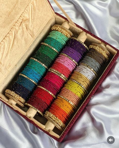 Thread bangles combo box dispatched 💟 Full combo in 1st picture- 1999₹ Box for ₹799 2nd picture combo - 24 colours- 1 dozen each bangles at just ₹1350 Size 2.2 to 2.10 available ✨ -colours may vary in combo boxes -bangle box may have slight imperfections as it is handmade -pls ask for size chart if there is confusion for bangle size. We use global sizes only. No size exchange available . #combobox #banglescombo #diwalibangles #karvachauthspecial #banglesbox #customisedbangles #velvetban... Bangles Aesthetic, Ishq Hai, Traditional Bangles, Desi Jewelry, Silk Thread Bangles Design, Silk Bangles, Beautiful Bangles, Thread Bangles Design, Braided Bracelet Diy