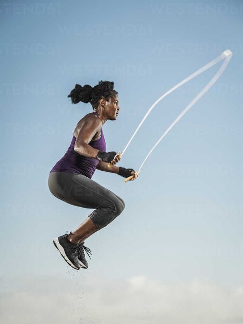 Black woman jumping rope in sky stock photo Woman Jumping, Jumping Rope, Reverse Image Search, Jump Rope, Model Release, Picture Perfect, Royalty Free Images, Black Women, Wonder Woman