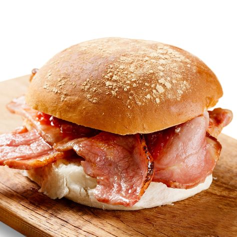 A bacon butty is a true classic. We like to eat ours in a fresh roll or a toasted English Muffin for a lovely treat anytime of day. This recipe can be easily embellished with the addition of an egg, some mushrooms, or whatever takes your fancy. A smooth cup of tea or coffee goes well with this one… Serves 6 Ingredients: 2 packs, Back Bacon Rashers 6 Bread Rolls Cooking Directions: Heat 1 tablespoon of oil in a large pan to a medium heat. Add the bacon and cook thoroughly to desired crispness. Bacon And Egg Roll, Bacon Roll, Bacon Sandwich, Scottish Recipes, Bacon Sausage, Burger Bar, British Food, English Muffin, Wrap Sandwiches