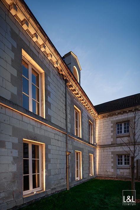 Lyss 1.0 is installed on the facade of the historic Champagne House Joseph Perrier. The outdoor projectors were strategically positioned on the outermost edges of the windowsills, where they create a luminous frame around the windows and around the entire facade, including the cornice. Caves Champagne Joseph Perrier, Châlons-en-Champagne, France Project by / Thiénot Architecture Light planning by / Lumensens Photo by / François Guillemin Parisian Lighting, France Project, Architectural Lighting Design, Outdoor Projector, Facade Lighting, Frame Light, Lighting Design Interior, Idea Design, Building Facade