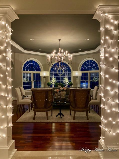 The entrance to the room has columns that are wrapped in white twinkling lights. Several years back, we pulled down round columns and built square ones. Indoor Column Christmas Decor, Decorating Columns For Christmas, Indoor Columns Ideas, Christmas Column Decor, Columns In Living Room, Column In Living Room, Indoor Columns, Christmas Family Room, Column Decor