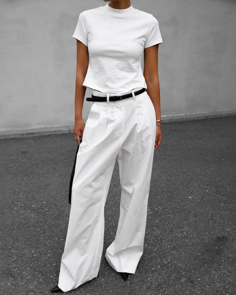 Color: White Lightweight cotton blend fabric Wide leg High rise Pleat front detail Pressed crease Side seam pockets Single illusion welt back pocket Belt loops Hook and bar closure Zip fly Unlined 97% Cotton 3% Polyurethane Dry Clean By The Frankie Shop. Imported *Style runs large; refer to measurements White Pants Outfit, White Jeans Outfit, The Frankie Shop, Frankie Shop, Outfit Look, Pocket Belt, Mode Inspo, Wide Pants, Casual Trousers