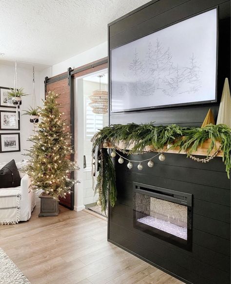 Christmas Mantle Decor With Tv, Garland Fireplace Mantle, Garland On Mantle, Christmas Fireplace Garland, Norfolk Pine Garland, Black Mantle, Christmas Garland Mantle, Christmas Fireplace Mantels, Fireplace Garland