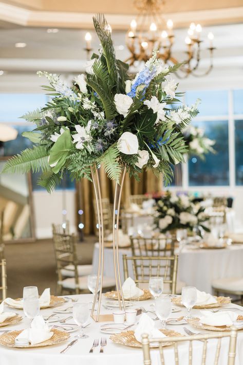 Blue Tropical Wedding Flowers, Blue And White Tropical Wedding, Tall Tropical Centerpiece, Centerpieces With Greenery, Prom Centerpieces, Beach Wedding Centerpieces Flowers, White Wedding Flowers Centerpieces, Tropical Centerpieces, Beach Wedding White