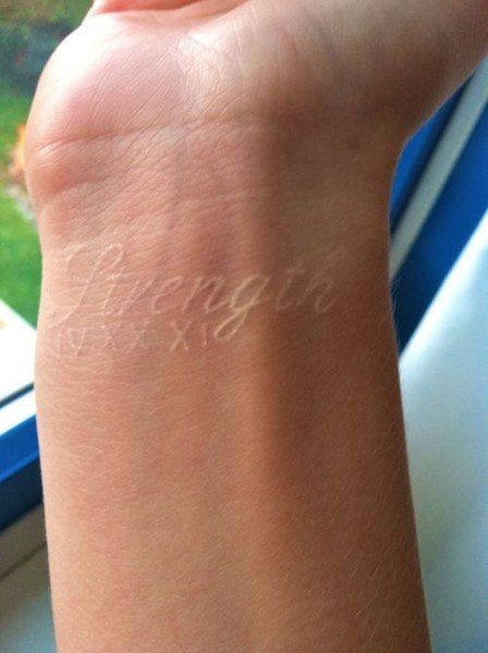 I’ve seen a lot of tattoo ideas for men, and they always seem to be a little better when they carry some personal meaning with them. The Roman numerals are definitely an indicator of this, and the cursive makes it seem more sophisticated.  #tattooforguys #tattoos #tattooart #tattoodesign #tattooidea Tattoo Strength, Tattoo Pretty, White Tattoos, White Ink Tattoo, Strength Tattoo, Matching Tattoo, Wrist Tattoo, White Tattoo, Skin Art