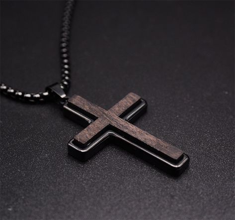 Add a touch of sophistication to your ensemble with our Ebony Wood Cross Necklace for Men. Handmade with care, this black stainless steel Christian pendant features a Real Ebony Wood pendant on a 24-inch chain. It's a symbol of faith and fashion. Highlights: UNUSUAL DESIGN: Wooden Cross Necklace for men using real natural ebony wood with High quality stainless steel. It not only retains the natural essence of the wood cross necklace but also takes into account the strong protection of stainless steel metal. CROSS PENDANT SIZE: Religious necklace/cross, Stainless steel+ebony wood, Polish finish, Pendant size:32mm*48mm, Free 24" box chain GIFT OF FAITH: Great gift choice for special occasions such as a Birthday, Graduation, Anniversary, Wedding, Christmas, Easter, Baptism, Valentine's Day. P Guys Necklaces, Boys Cross Necklace, Wooden Cross Necklace, Cross Necklace Men, Music Designs, Cross Necklace For Men, Christian Cross Necklace, Fashion Highlights, Cross Jewelry Necklace