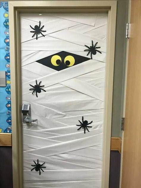 25+ DIY Halloween Classroom Door Decorations - HubPages Halloween Door Office Decorations, Front Office Halloween Decor, School Door Halloween, Mummy Classroom Door, Seasonal Classroom Door Ideas, Halloween Themes For Office, Door Decorating Ideas For Halloween, Halloween Library Door Decorations, Halloween Office Decorations Ideas