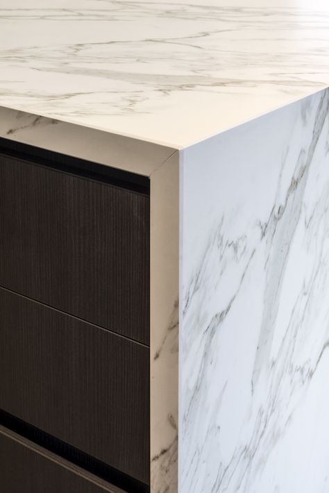 Close up of a Neolith Calacatta island bench with beautiful bookmatching. Installation by @pazstone_  @rachellewisphotography  #cdkstone #neolith #neolithcalacatta #sinteredcompactsurface #extraordinarysurface #scratchresistant #stainresistant #heatresistant #coldresistant #resistanttouvfading #designinspiration #lowmaintenance #greyandwhite #marblelook #slabs #bookmatching Stone Waterfall Kitchen Island, Waterfall Marble Countertop, Waterfall Benchtop, Stone Benchtop Kitchen, Neolith Calacatta, Calacatta Marble Kitchen, Kitchen Platform, Penthouse Kitchen, Marble Kitchen Counters