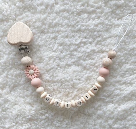 Pacifier chain 🤍 Pacifier chain with wooden letters, wooden clip, silicone and wooden beads. All pacifier chains are lovingly handcrafted specifically for you with your NAME of your choice. Simply mention the child's name and we will send you a beautiful pacifier chain. As a gift for a birth or simply as a small gift for friends, family or acquaintances. Small Gift For Friends, Dummy Chain, Small Gifts For Friends, Dummy Clips, Pacifier Holder, Silicone Bracelets, Pacifier Clip, Wooden Letters, Small Gift