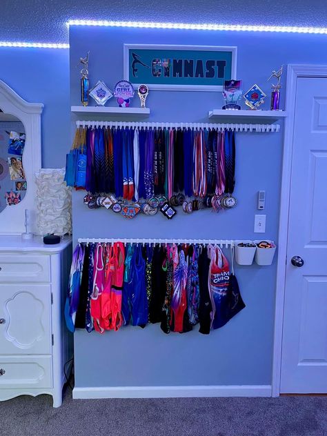 Gymnast Room Ideas, Gymnast Bedroom Ideas, Cheer Medal Display, Trophy Organization Ideas, Gymnastic Room Ideas, Gymnastic Themed Bedroom, Cheer Wall Ideas, Cheer Gym Decor, Gymnastic Bedroom Ideas