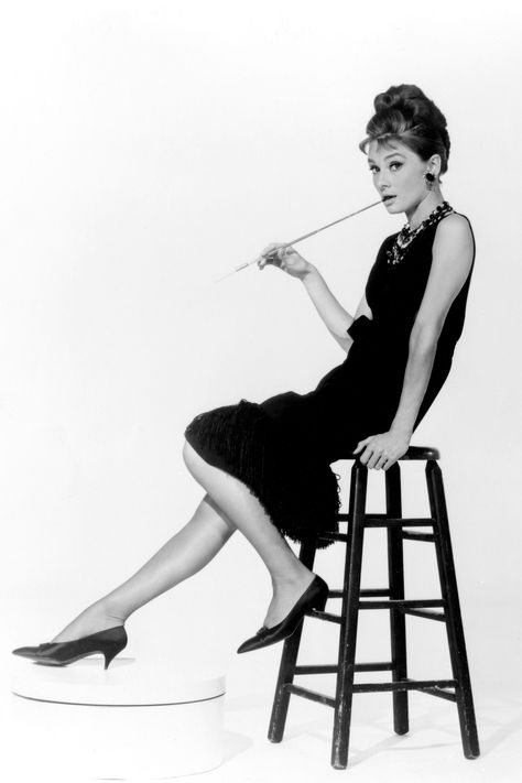 Audrey Hepburn was known to frequent ballet flats, but as Holly Golightly the pointed flats and kitten heels worn throughout became the ultimate symbol of style.  Everett Collection  - HarpersBAZAAR.com Audrey Hepburn Breakfast At Tiffanys, George Peppard, Cristobal Balenciaga, Holly Golightly, Cinema Movie, Jean Patou, Camilla Parker Bowles, Audrey Hepburn Style, Elsa Schiaparelli